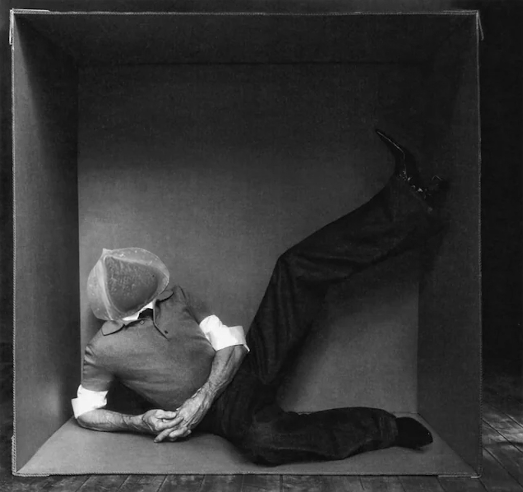 willem dafoe lounging in large box